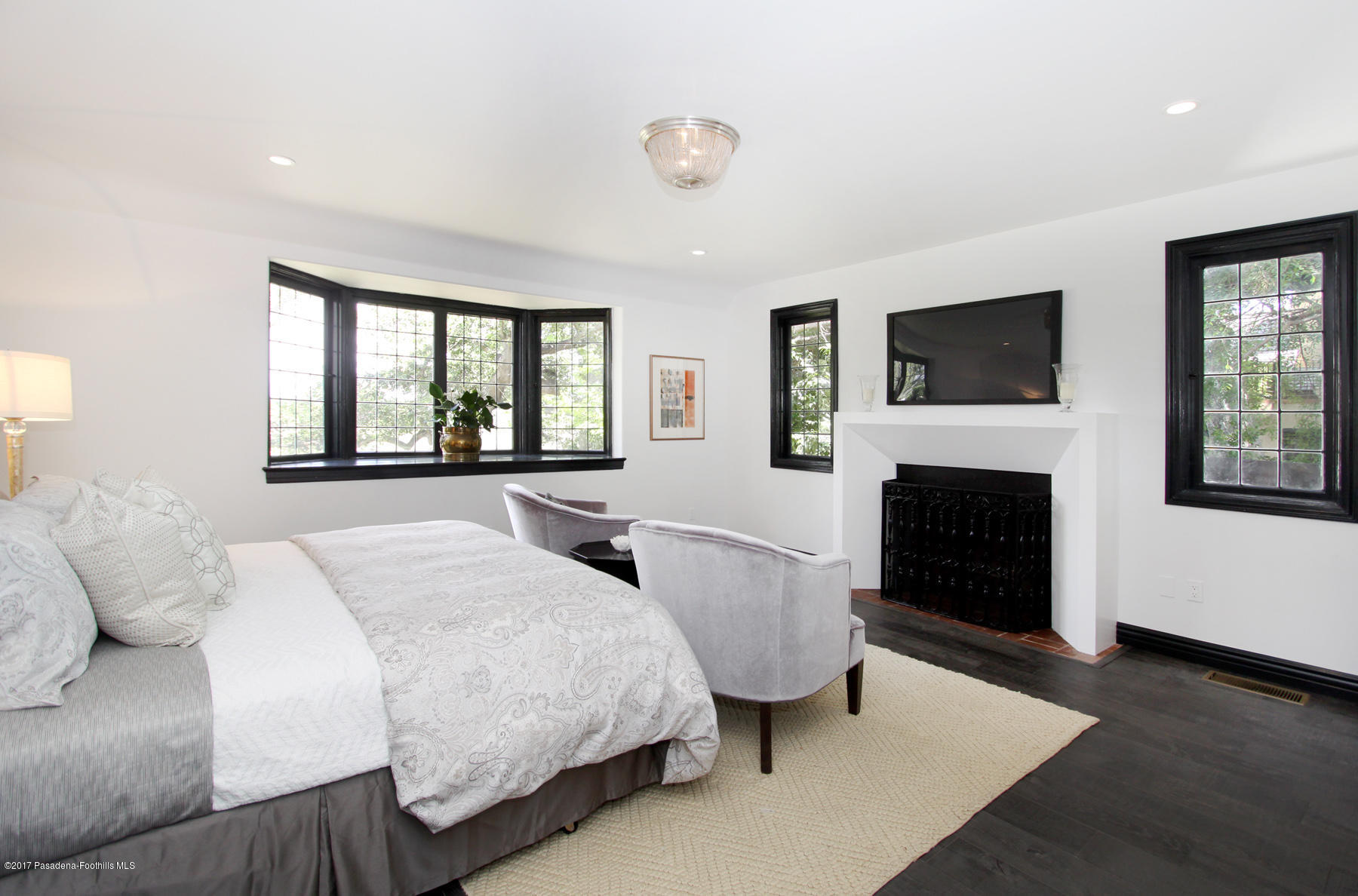 1415 Parkview Avenue Pasadena, CA 91103 - Photo 20 of 35 a bedroom with a bed and a fireplace