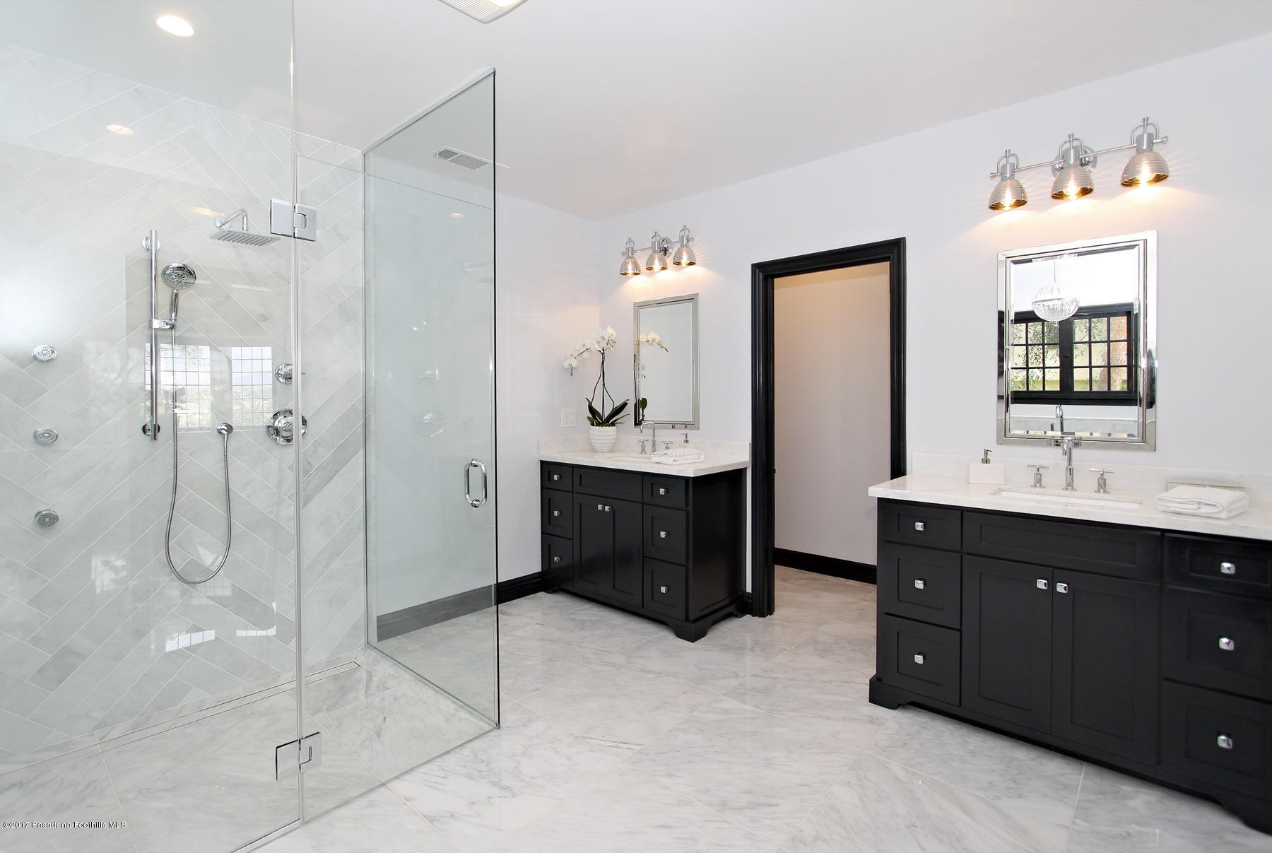 1415 Parkview Avenue Pasadena, CA 91103 - Photo 22 of 35 a bathroom with a double vanity sink a mirror and a shower