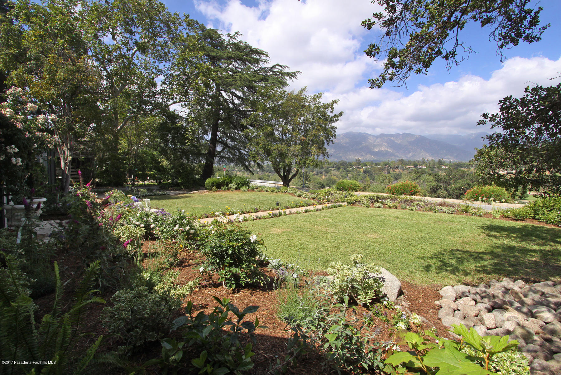1415 Parkview Avenue Pasadena, CA 91103 - Photo 4 of 35 a view of a field with a tree