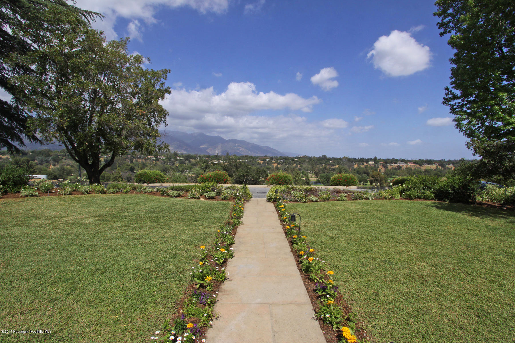 1415 Parkview Avenue Pasadena, CA 91103 - Photo 5 of 35 a view of a street with a yard in front of it