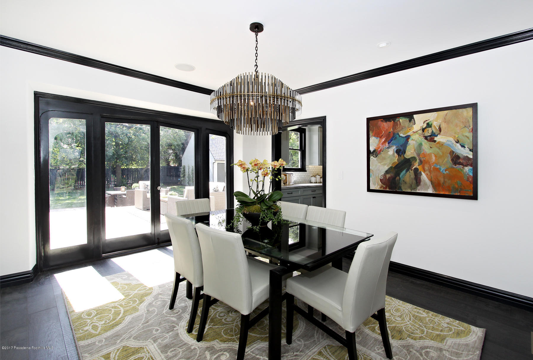 1415 Parkview Avenue Pasadena, CA 91103 - Photo 9 of 35 a dining room with furniture a chandelier and wooden floor