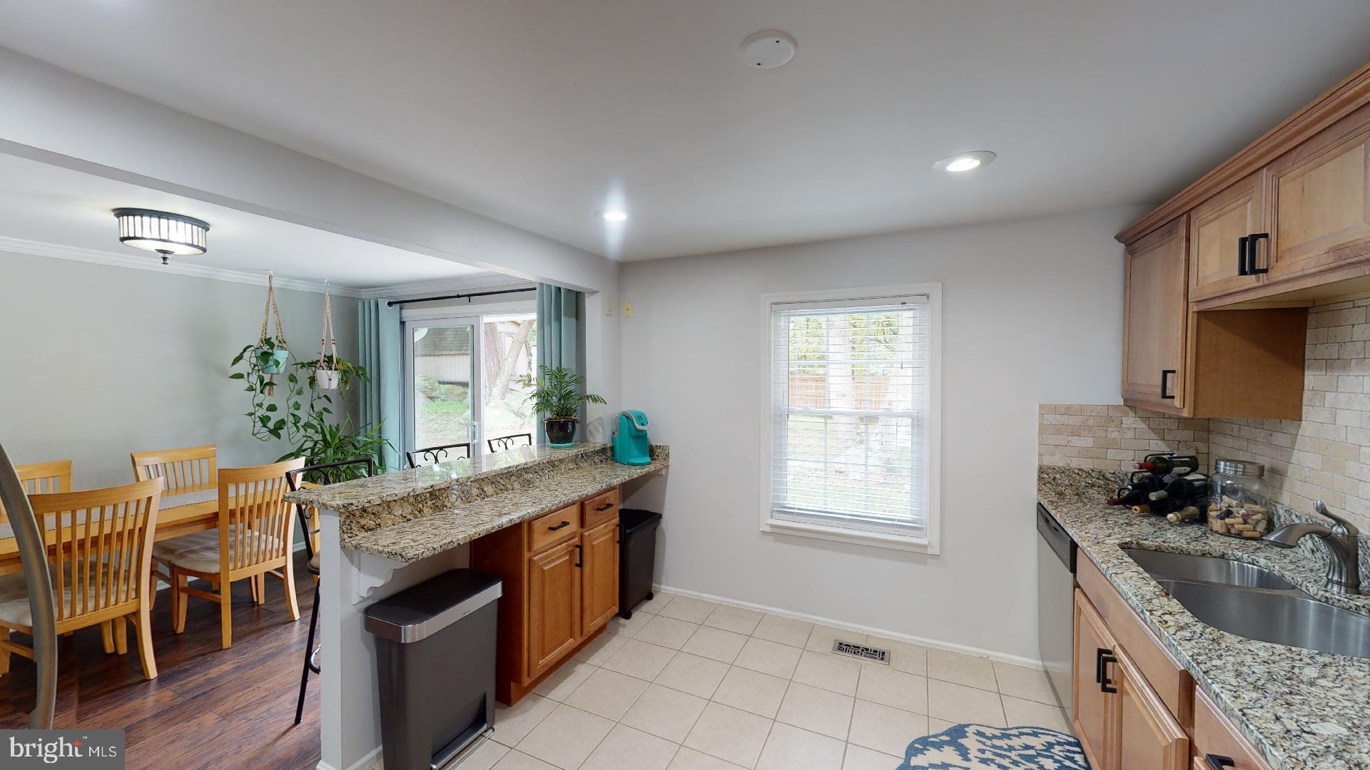 7808 Metacomet Road Hanover, MD 21076 - Photo 13 of 33 Kitchen features ceramic tile