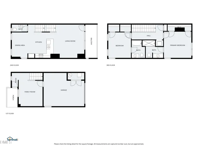 a view of a brick house with many windows and a yard