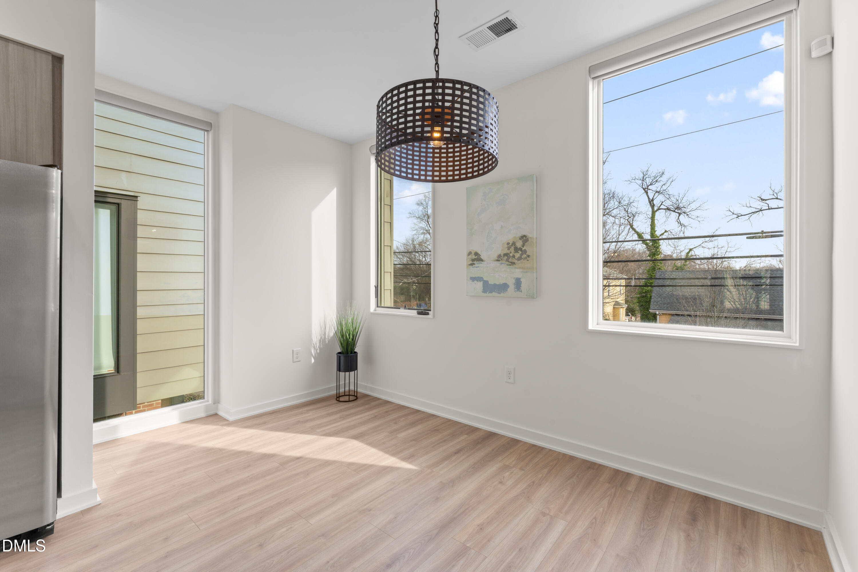 536 South Person Street Raleigh, NC 27601 - Photo 22 of 38 an empty room with wooden floor and windows