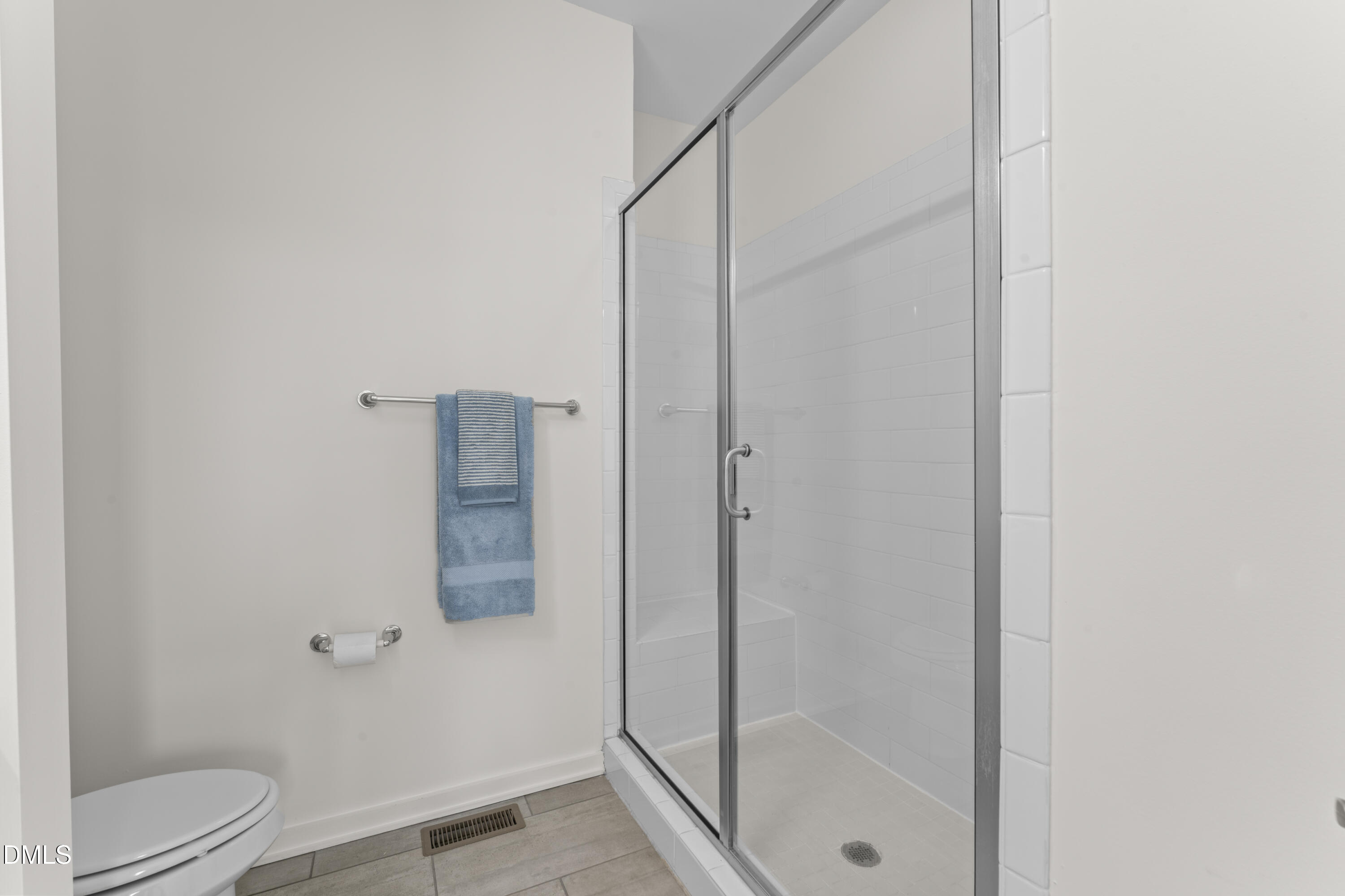 536 South Person Street Raleigh, NC 27601 - Photo 27 of 38 a bathroom with a glass shower door