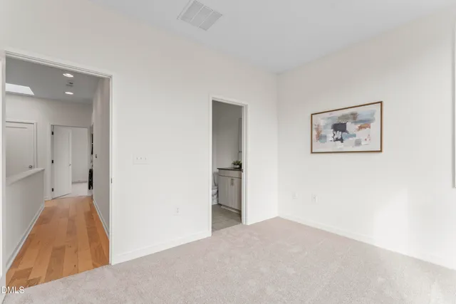 a bathroom with a toilet a sink and a mirror