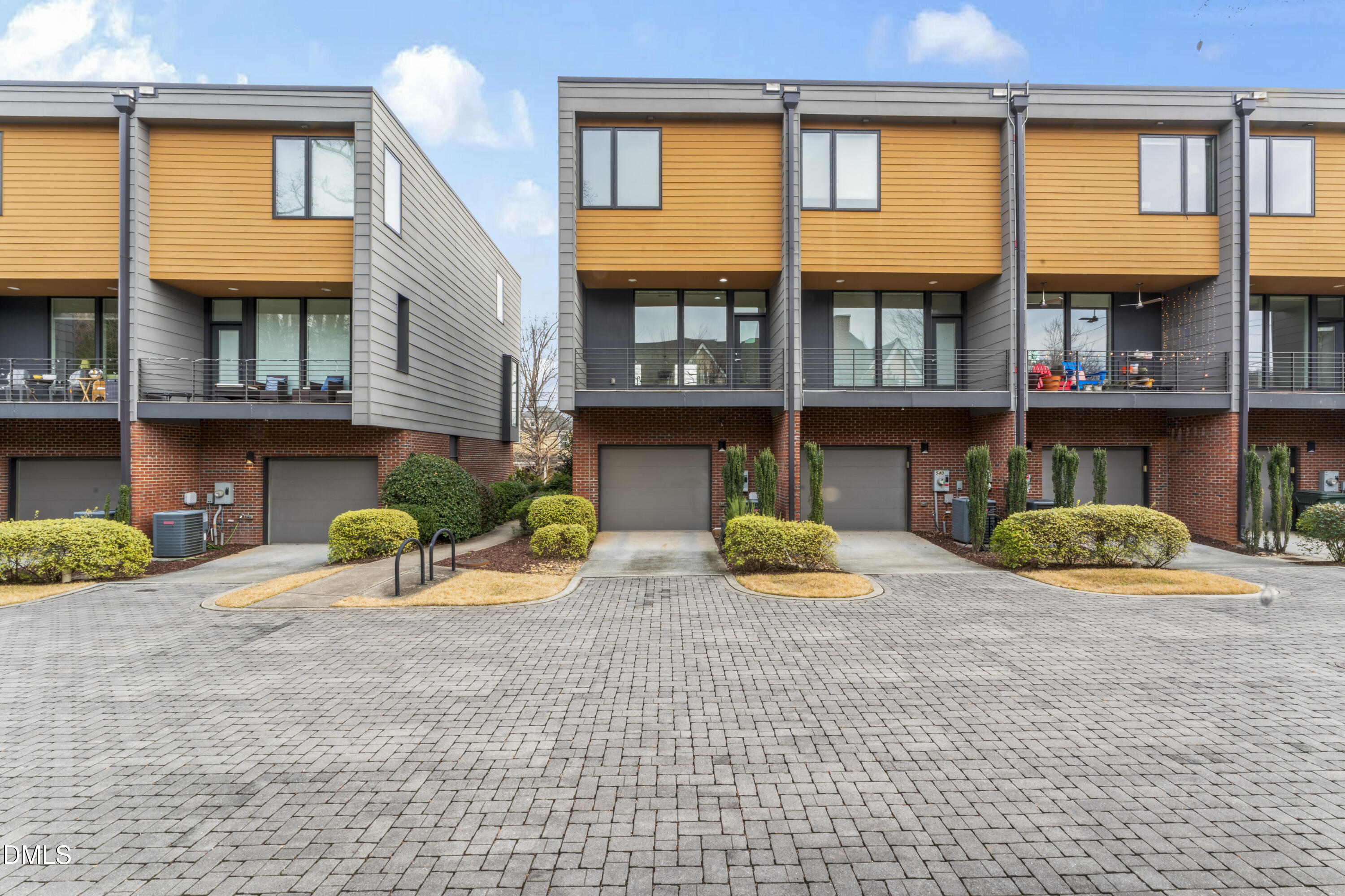 536 South Person Street Raleigh, NC 27601 - Photo 31 of 38 a view of a brick house with many windows and a yard