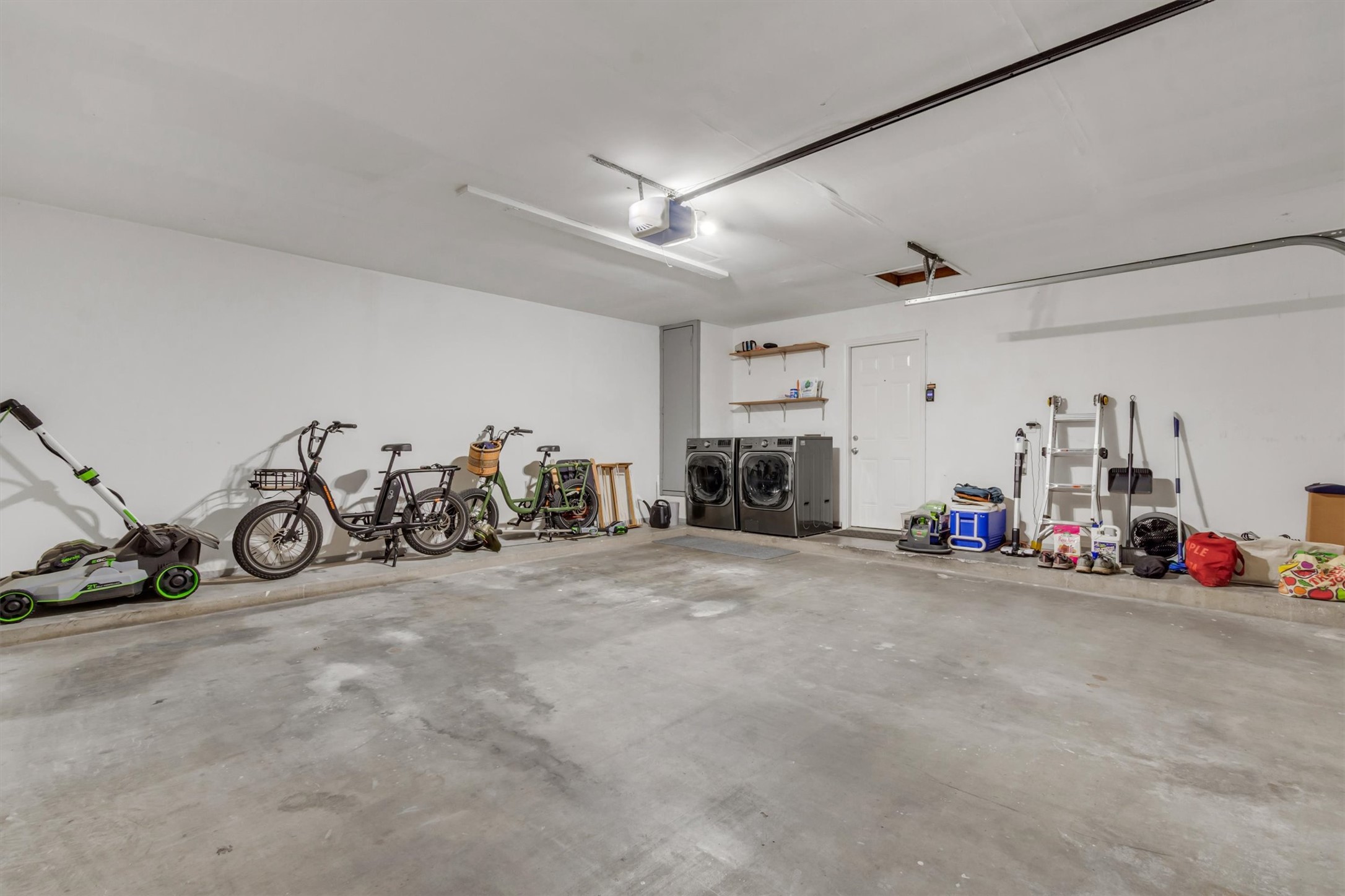 10809 Parkfield Drive Austin, TX 78758 - Photo 20 of 24 Spacious 2-car attached garage with washer / dryer hookups and plenty of space to add storage