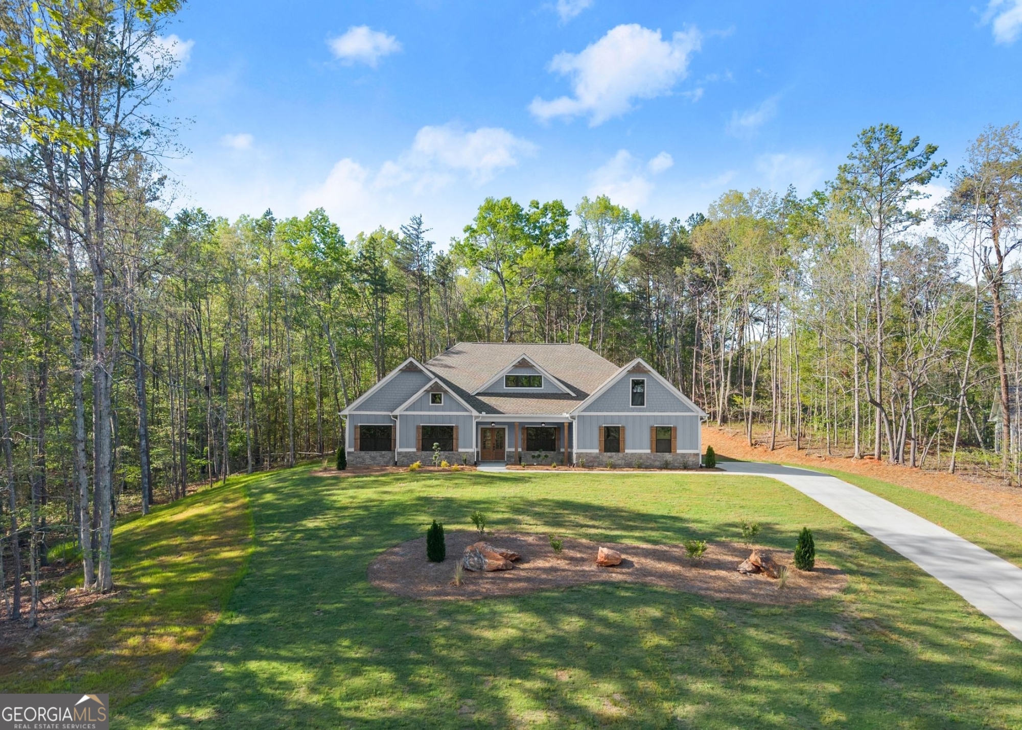 206 Shoals Way Clarkesville, GA 30523 - Photo 2 of 34 a front view of a house with garden