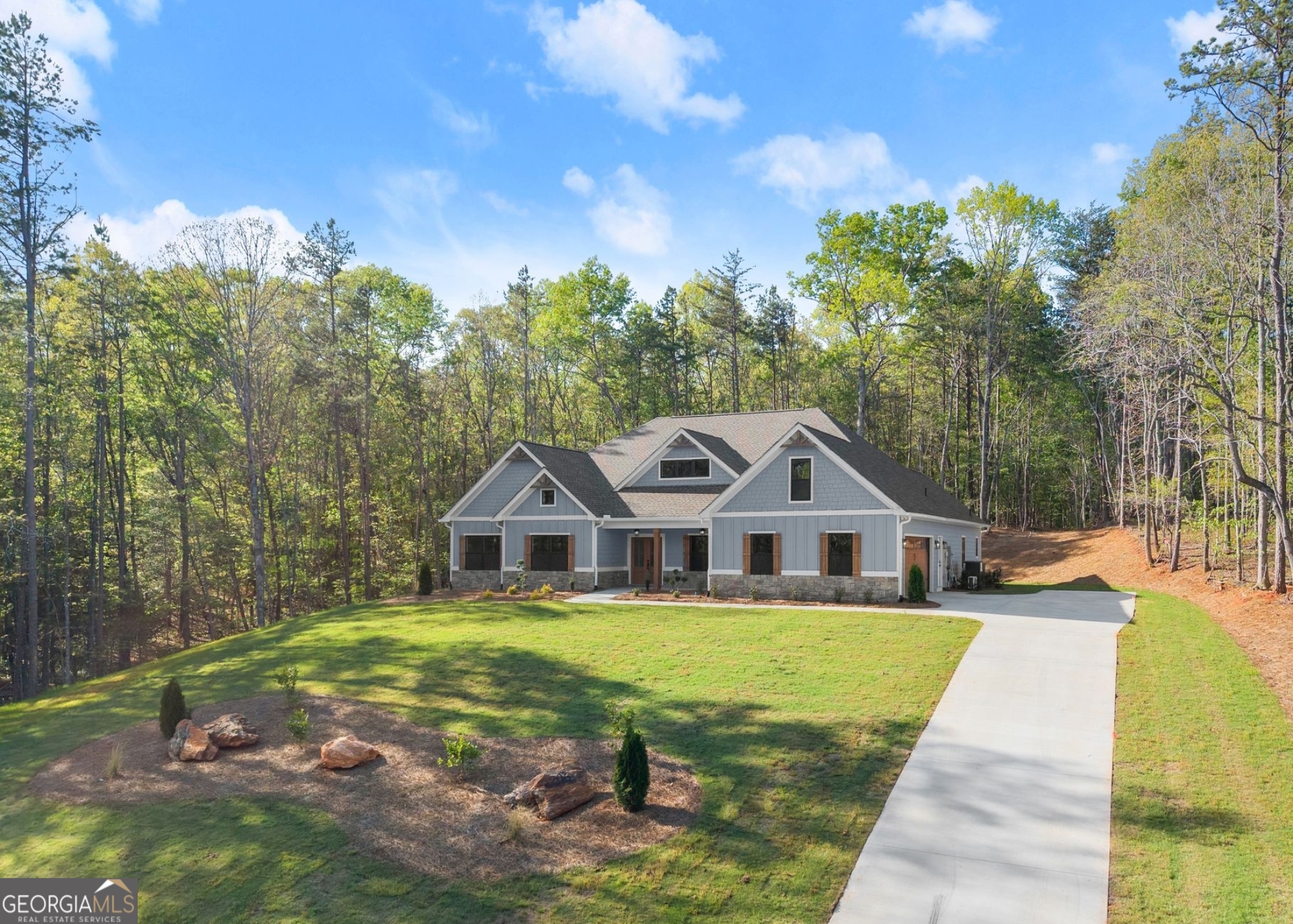 206 Shoals Way Clarkesville, GA 30523 - Photo 3 of 34 a front view of a house with garden