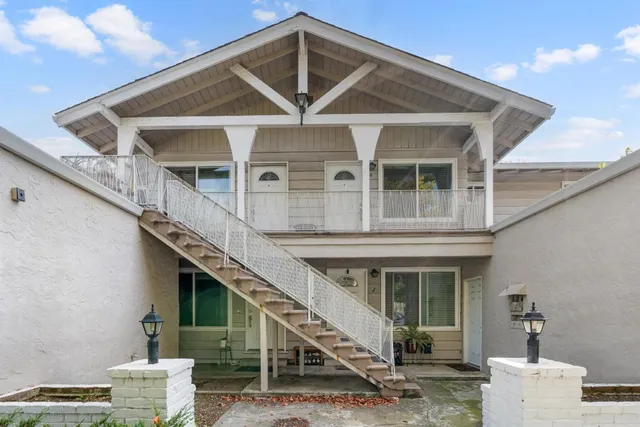 a front view of a house with a staircase