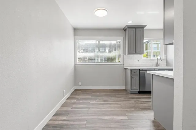a kitchen with a sink stove and refrigerator