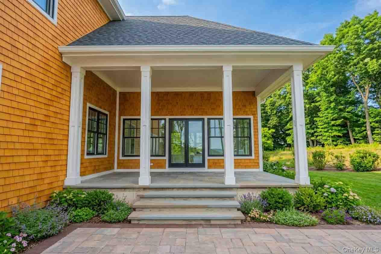 106 Cove Road Asharoken, NY 11768 - Photo 37 of 46 Property entrance with roof with shingles, french doors, and a porch