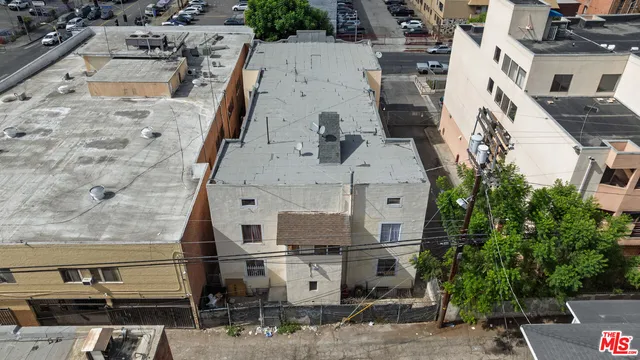 an aerial view of residential houses with outdoor space