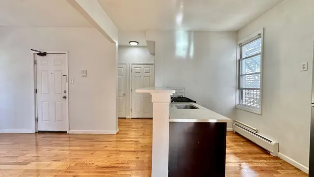 a view of a kitchen with a sink and dishwasher
