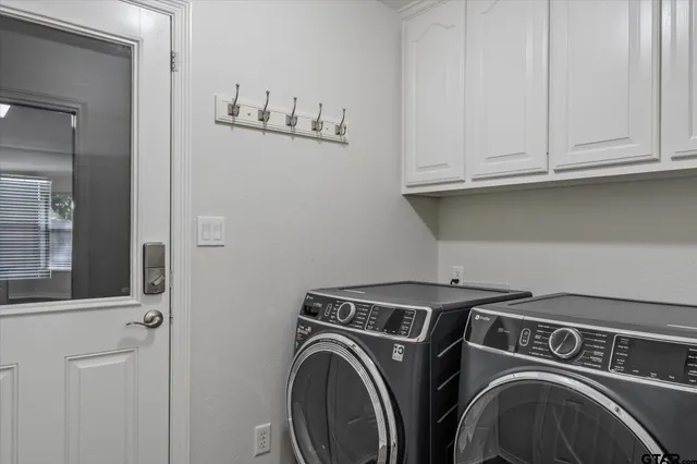 a utility room with dryer and washer