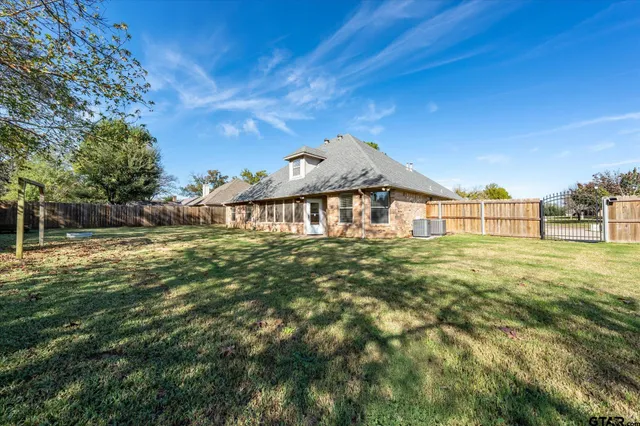 a view of a house with a big yard