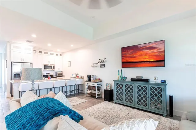 a kitchen with stainless steel appliances granite countertop a sink refrigerator and microwave