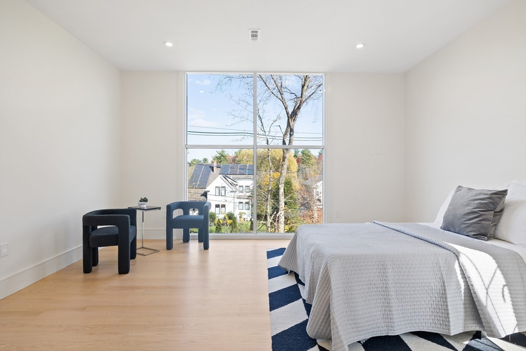 58 Chestnut Street Lynnfield, MA 01940 - Photo 20 of 42 a bedroom with a bed and a table