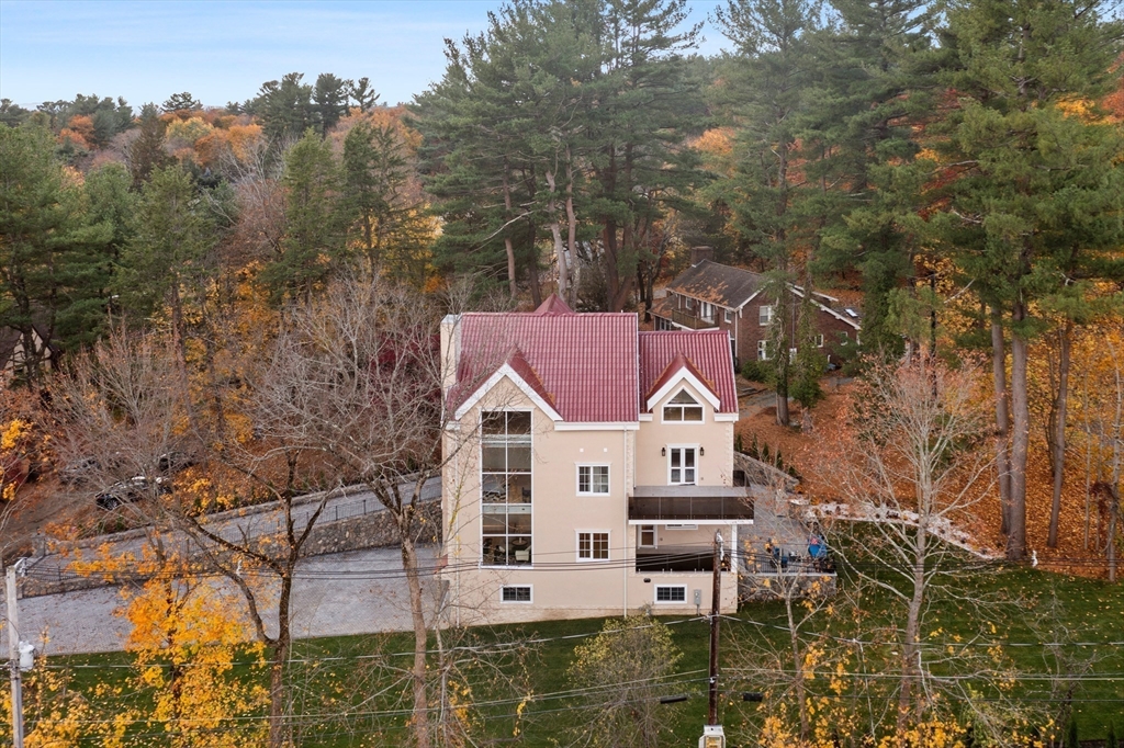 58 Chestnut Street Lynnfield, MA 01940 - Photo 32 of 42 a aerial view of a house with a yard