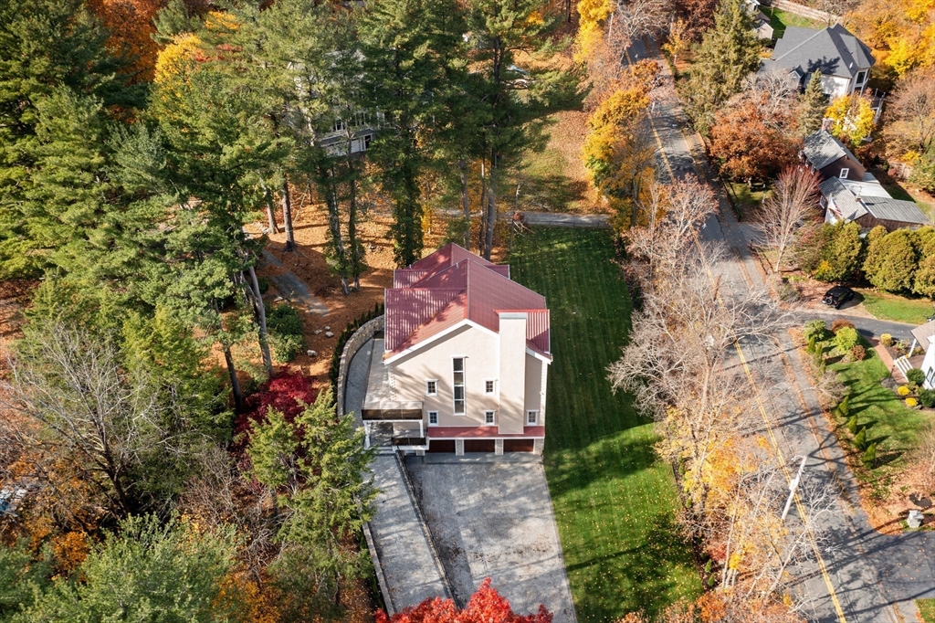 58 Chestnut Street Lynnfield, MA 01940 - Photo 34 of 42 an aerial view of a house with a yard and large trees
