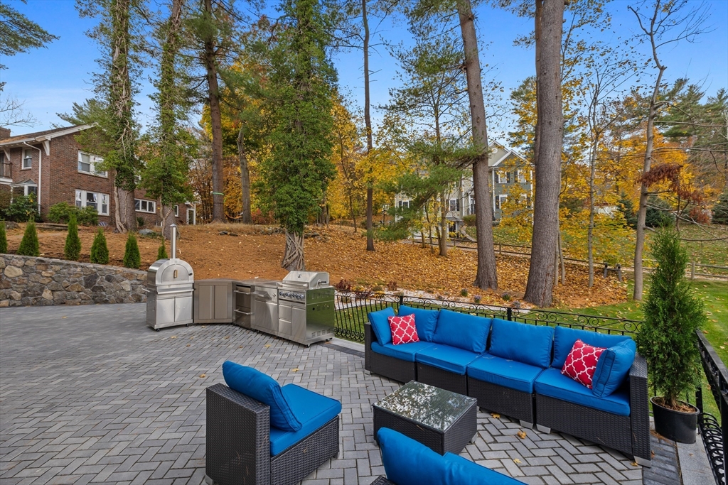 58 Chestnut Street Lynnfield, MA 01940 - Photo 37 of 42 a outdoor living space with patio furniture and a fireplace