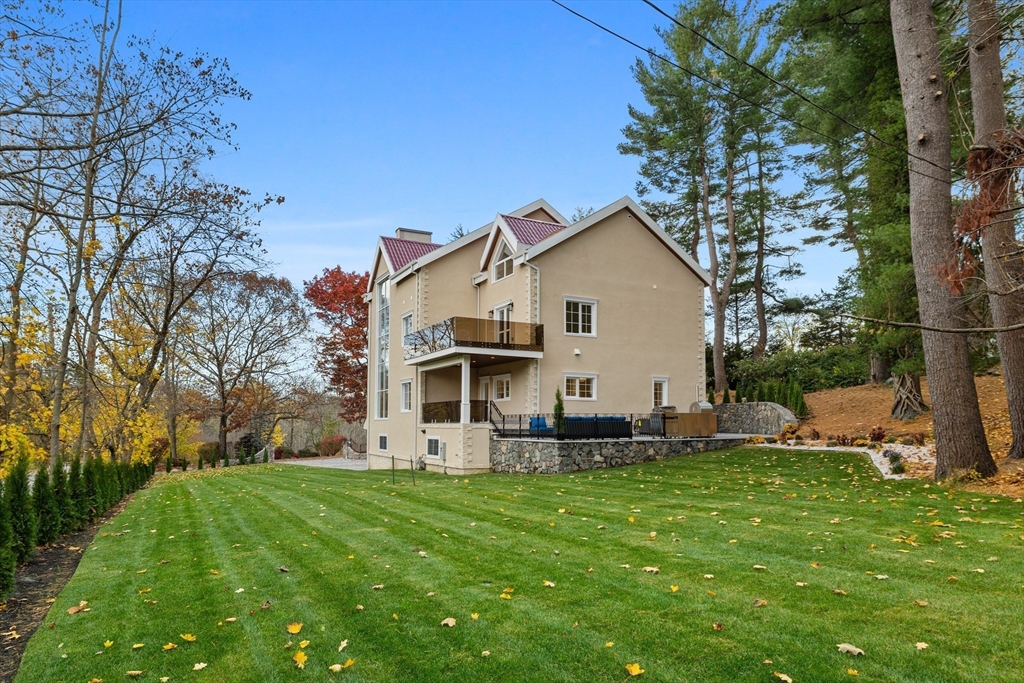 58 Chestnut Street Lynnfield, MA 01940 - Photo 39 of 42 a front view of house with yard and green space