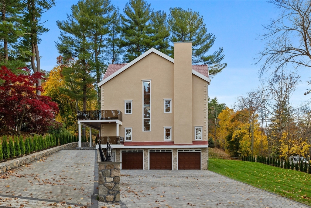 58 Chestnut Street Lynnfield, MA 01940 - Photo 40 of 42 a view of a house with a yard and sitting area