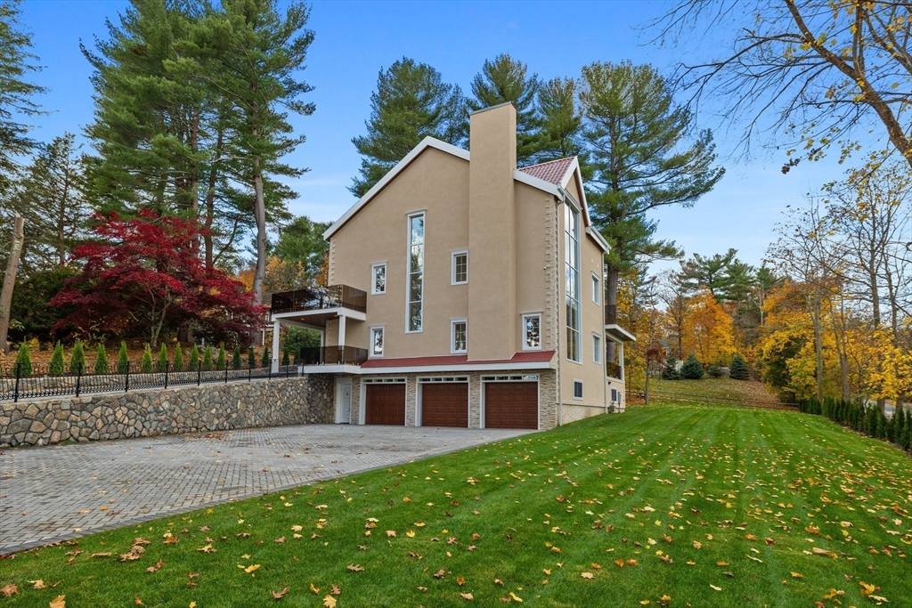 58 Chestnut Street Lynnfield, MA 01940 - Photo 41 of 42 a view of a house with a yard