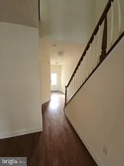 a view of entryway with wooden floor