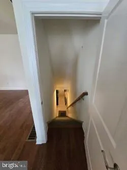 a view of a hallway with stairs