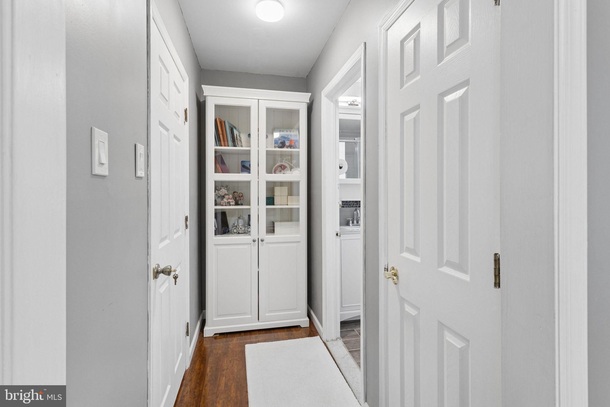 252 Sandringham Road Cherry Hill, NJ 08003 - Photo 17 of 31 a view of a hallway with wooden floor and entryway