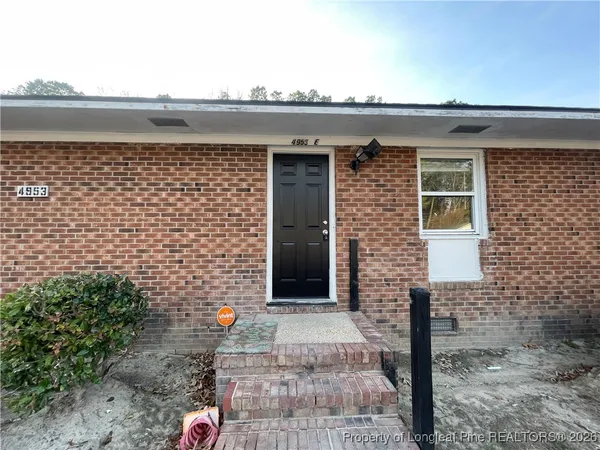 a front view of a building with a outdoor space