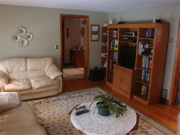 68 Middle Road Amesbury, MA 01913 - Photo 8 of 15 a living room with furniture and book shelf