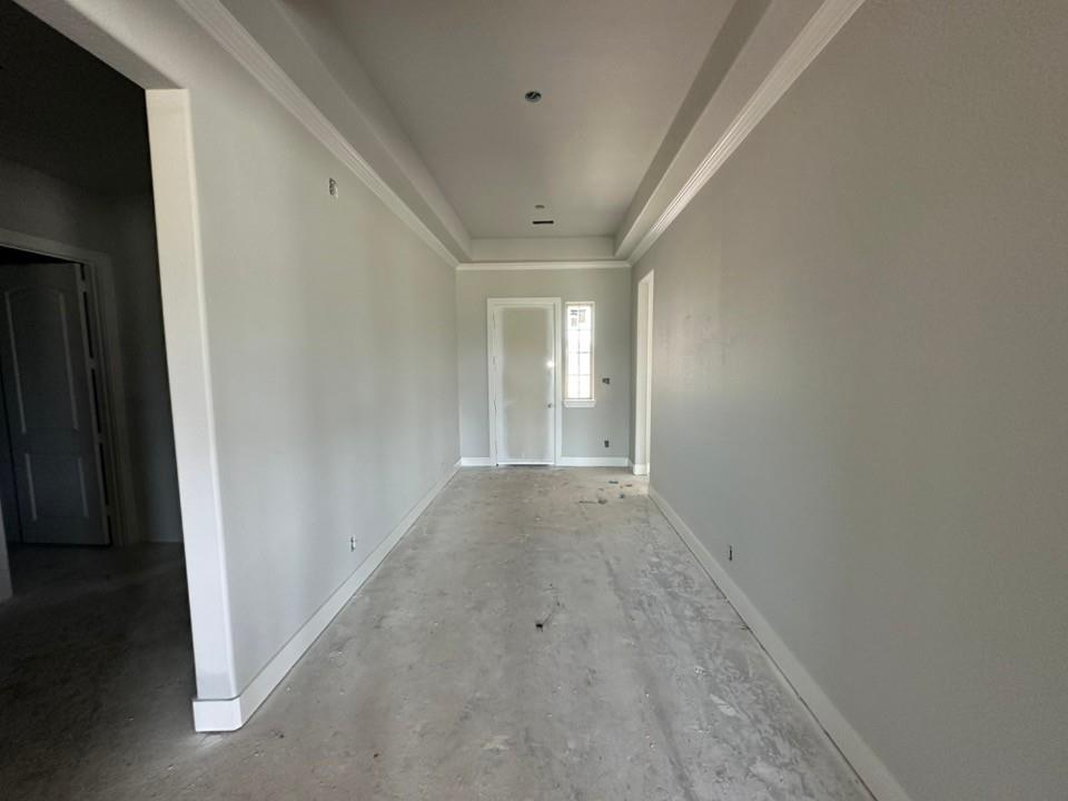 295 Brown Road Leonard, TX 75452 - Photo 6 of 26 Interior hallway featuring light gray walls, white baseboards, and white crown molding