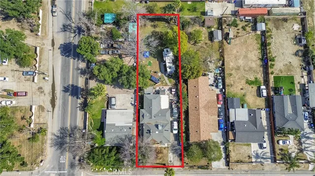 a city street filled with lots of flowers and buildings