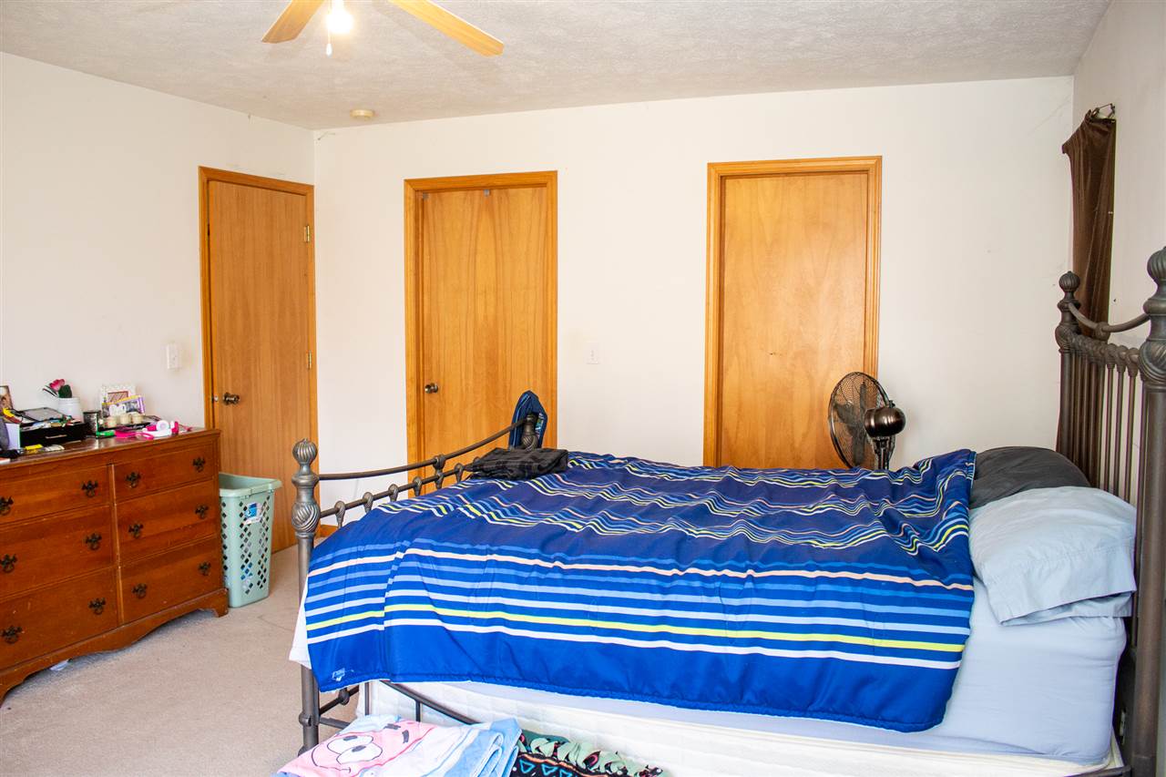 426 Lockwood Road Davis, IL 61019 - Photo 11 of 25 a bedroom with a bed and a dresser