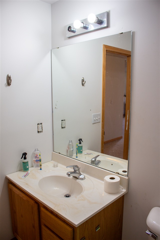 426 Lockwood Road Davis, IL 61019 - Photo 23 of 25 a bathroom with a sink and a mirror