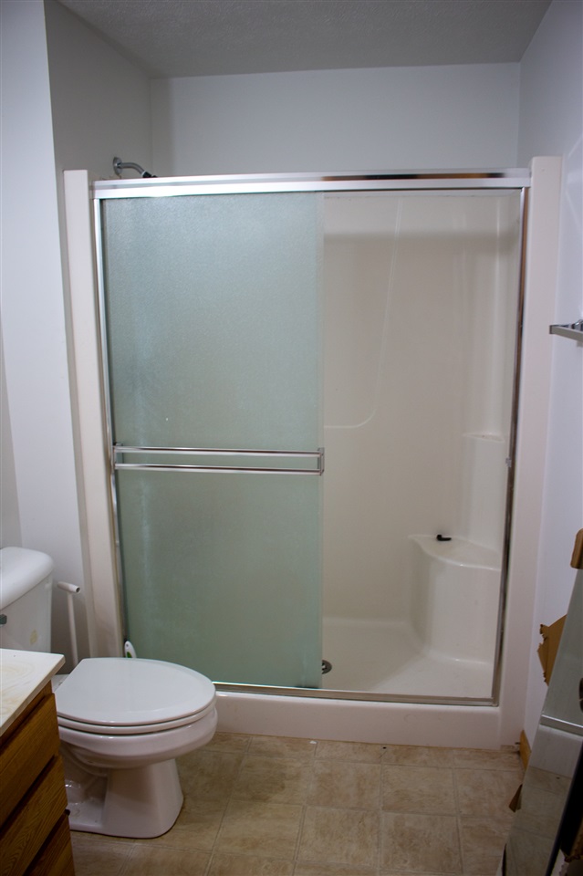 426 Lockwood Road Davis, IL 61019 - Photo 24 of 25 a bathroom with a shower and a toilet