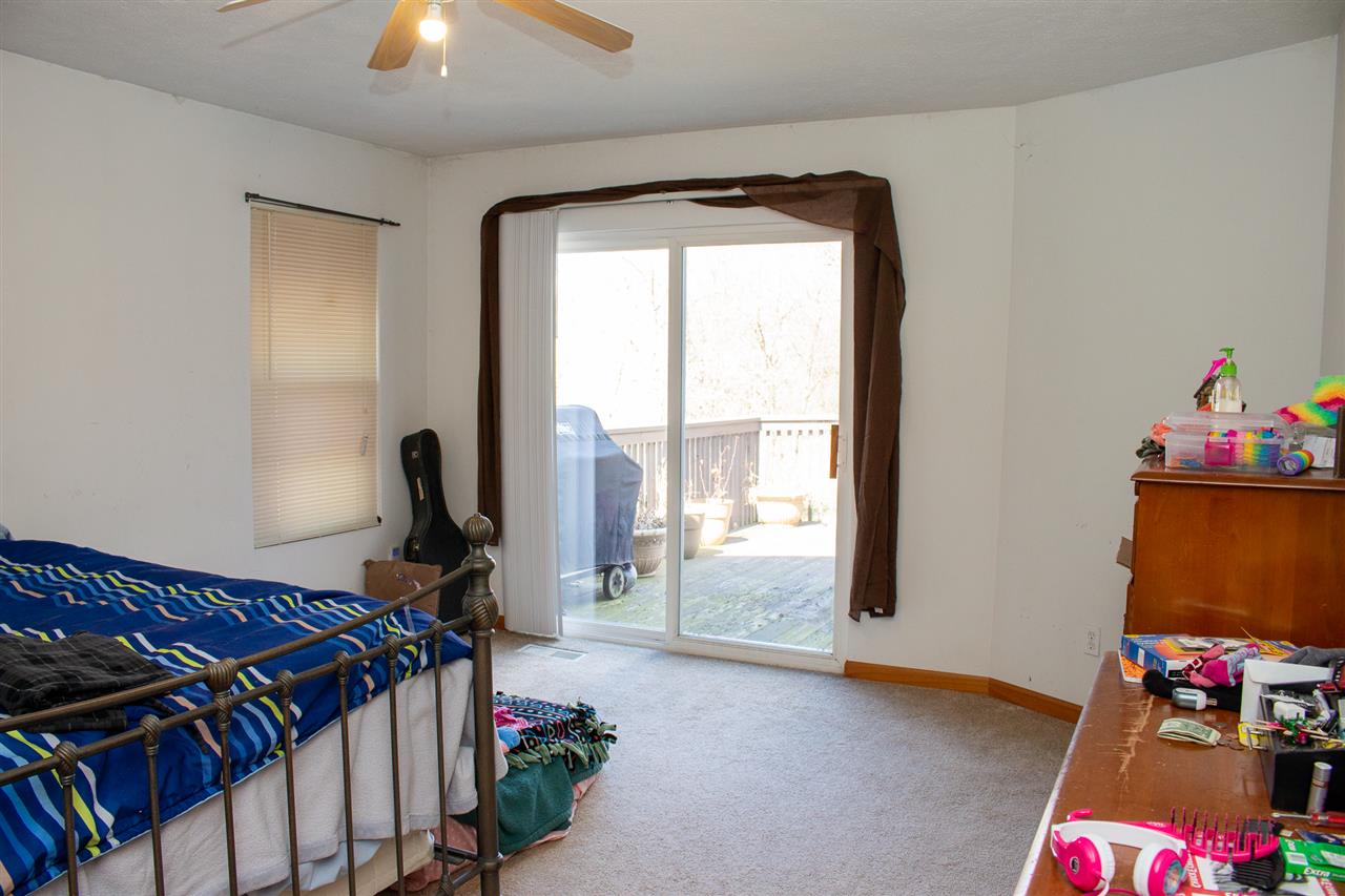 426 Lockwood Road Davis, IL 61019 - Photo 10 of 25 a bed room with a bed and a window