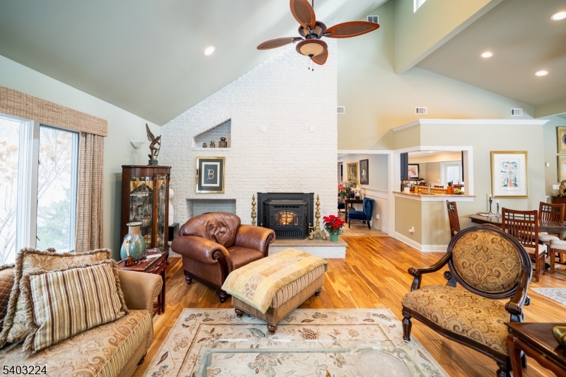 33 Ward Road Blairstown, NJ 07825 - Photo 8 of 49 a living room with furniture a flat screen tv and a fireplace