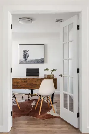 a living room with furniture and a rug