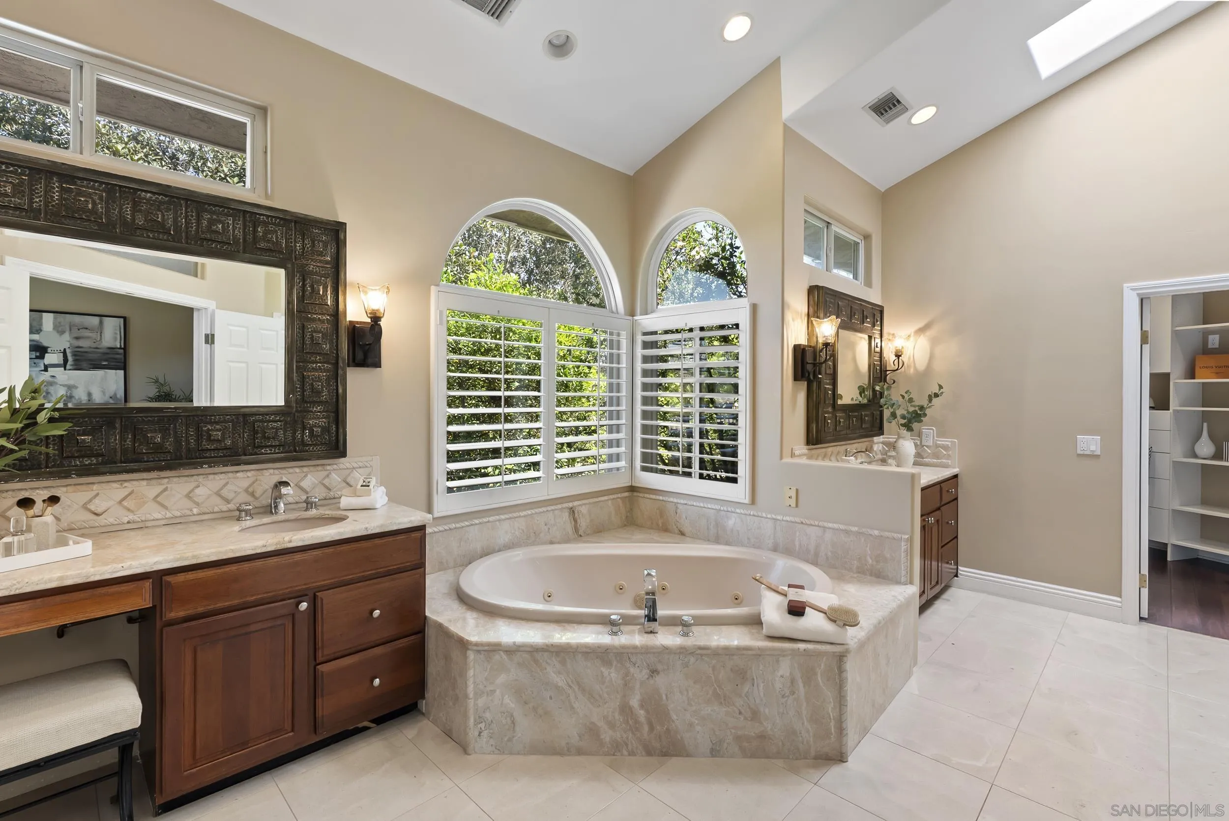 14998 Budwin Lane Poway, CA 92064 - Photo 26 of 44 a bath tub sitting next to a bathroom sink