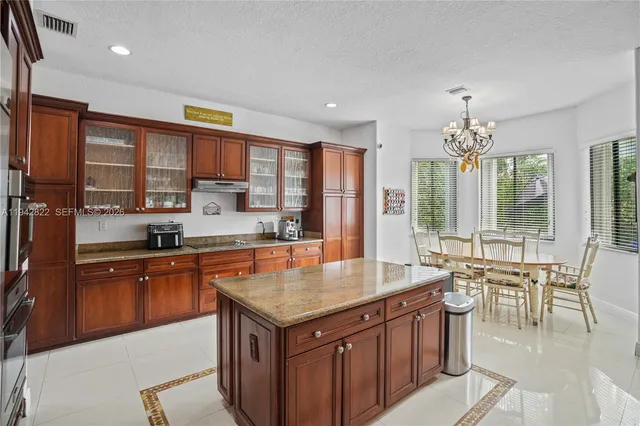 a swimming pool with outdoor seating and city view