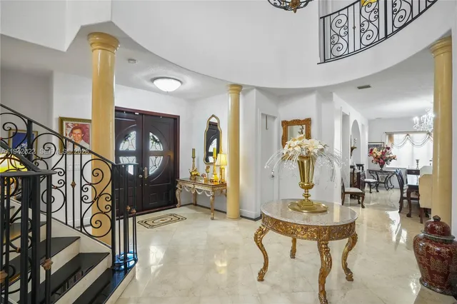 a view of a backyard with plants and patio