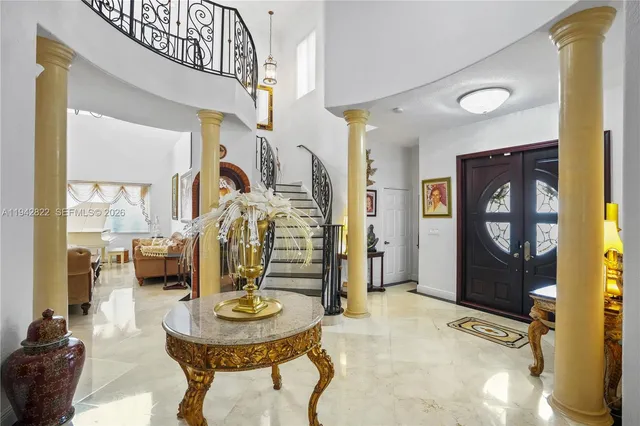 a view of a house with pool porch and sitting area