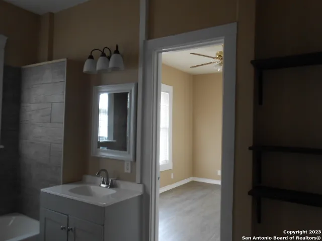 a bathroom with a sink and mirror