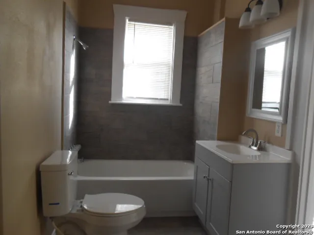 a bathroom with a sink toilet and bathtub
