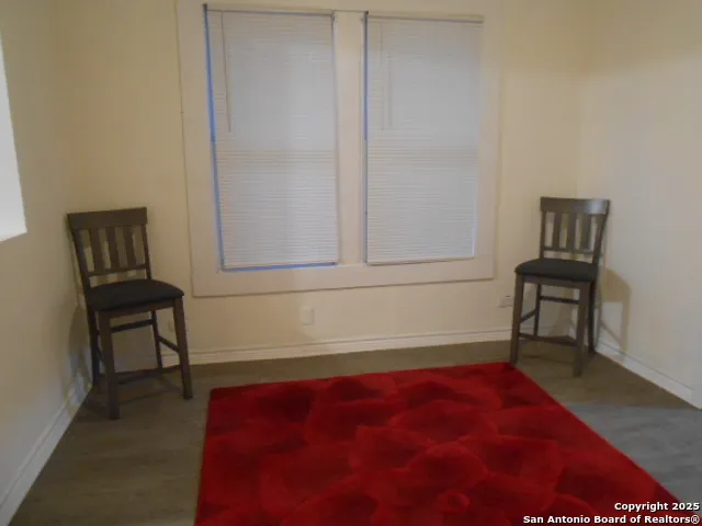 a bedroom with a bed and a bookshelf