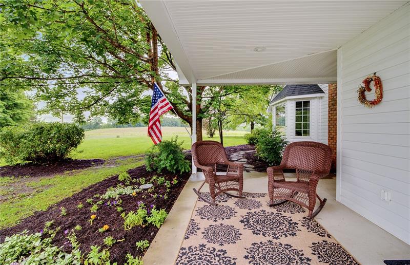 343 Glass Road New Castle, PA 16101 - Photo 4 of 25 Covered Cement porch with electric outlets and water hook up. Meander across the stone path to the other covered Cement porch.